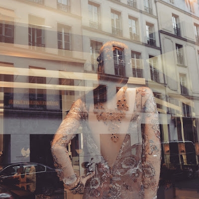 Window reflection on rue Saint Honoré.